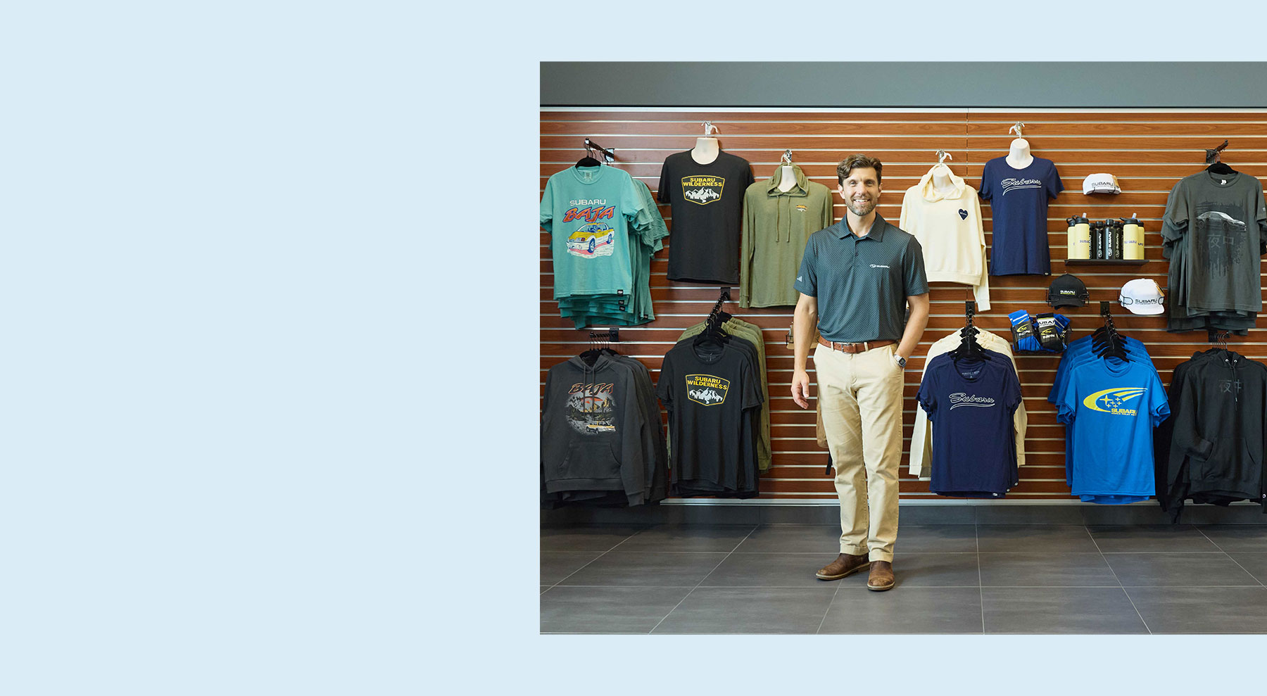 Subaru employee standing in front of gear store