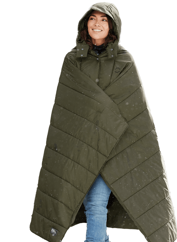 smiling woman wearing a poncho