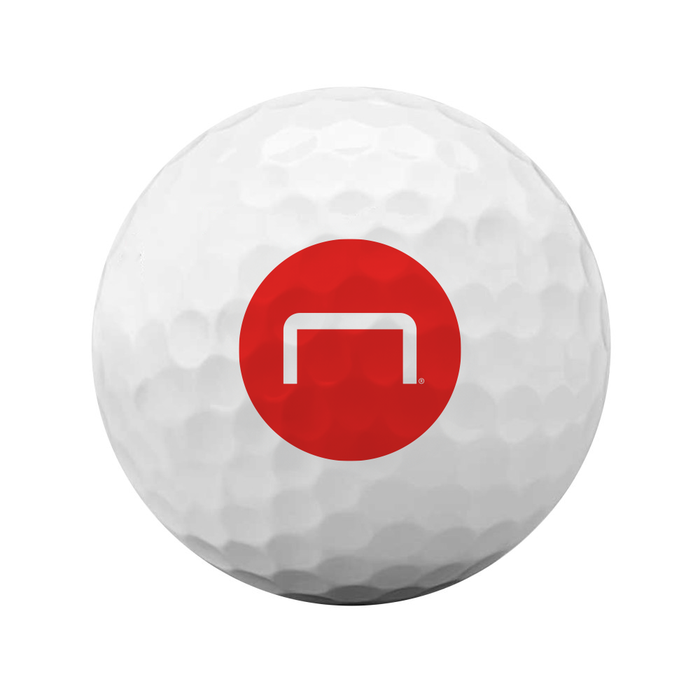 Personalized golf ball with a full-sized red circular Staples logo as a stand in for your brands logo