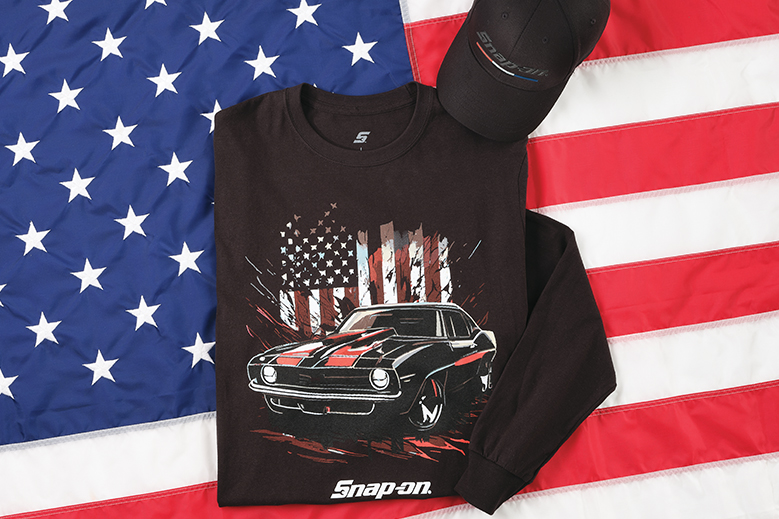 Folded graphic long-sleeve tee and cap on American flag